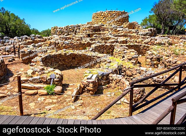 Arzachena, Sardinia / Italy - 2019/07/19: Archeological ruins of Nuragic complex La Prisgiona - Nuraghe La Prisgiona - with stone main tower and preserved...