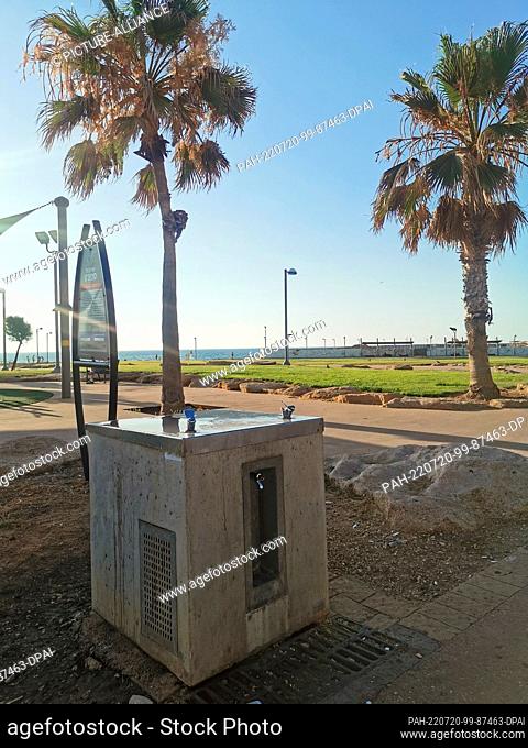 19 July 2022, Israel, Tel Aviv: A drinking water dispenser on the mile-long beach promenade. Fill up your water bottle and you're done