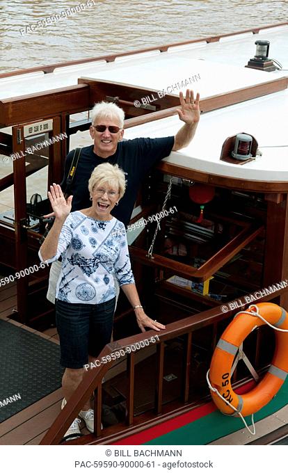 South East Asia, Singapore, Senior tourist couple on boat traveling on river