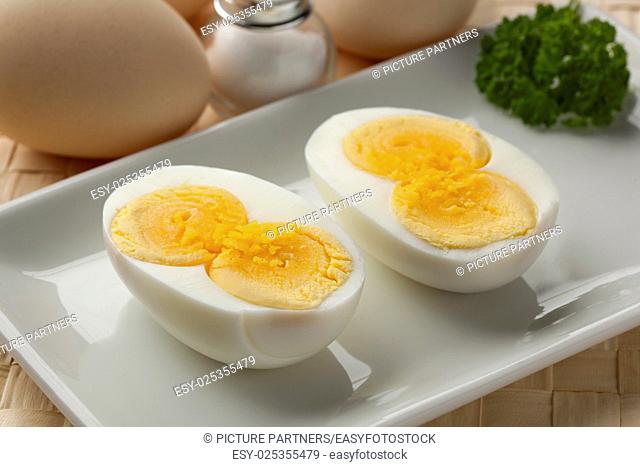 Cooked double yolk egg on a dish