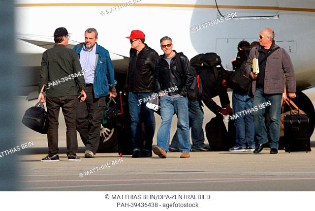 dpa-exclusive - US actor George Clooney (C) and his film crew arrive at the airport of Cochstedt,  Germany, 12 May 2013. Clooney is in Germany to shoot his new...