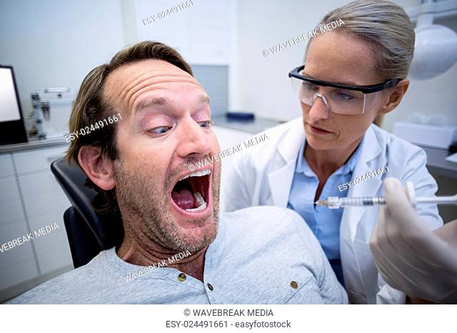 Male patient scared during a dental check-up