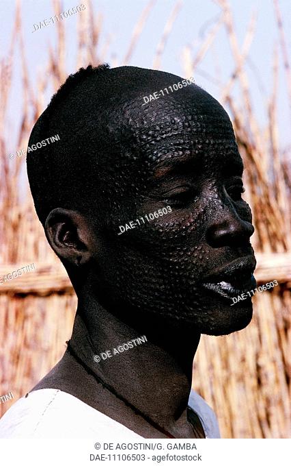 Nuer man with ornamental scarification on his face, South Sudan