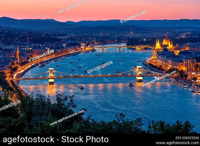 Sunset Cityscape Budapest along Danube with Chain Bridge and Parliament Building