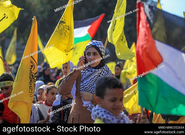 Palestinians attend a rally marking the 58th anniversary of the Fatah movement foundation. Gaza City. Palestine