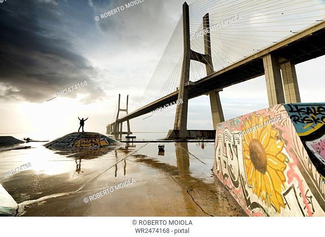The colorful murals around Vasco Da Gama bridge emphasize its architecture and atmosphere at dawn, Lisbon, Portugal, Europe