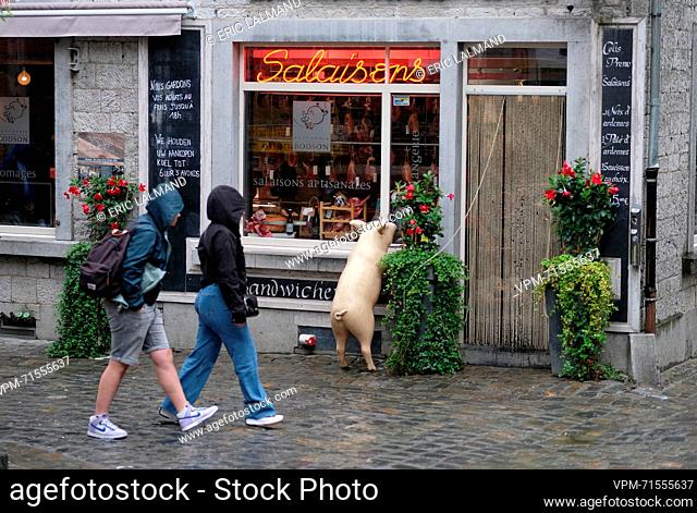 Illustration picture shows a tourist with a rain coat in Durbuy, Thursday 03 August 2023. BELGA PHOTO ERIC LALMAND