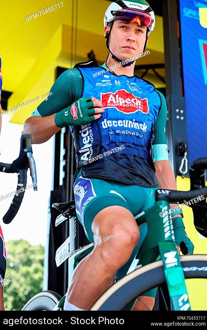 Belgian Jasper Philipsen of Alpecin-Deceuninck wearing a cooling vest over his green jersey at the start of stage 10 of the Tour de France cycling race, a 167