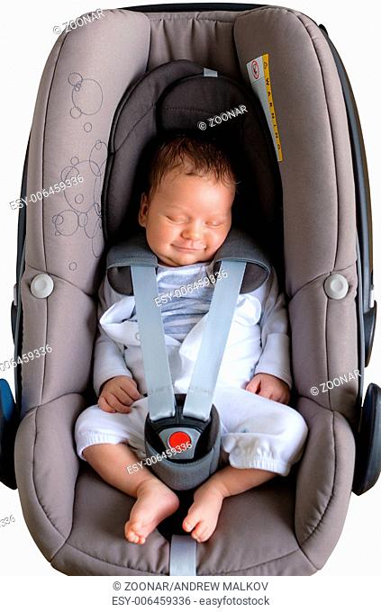 Cute newborn smiling in car seat