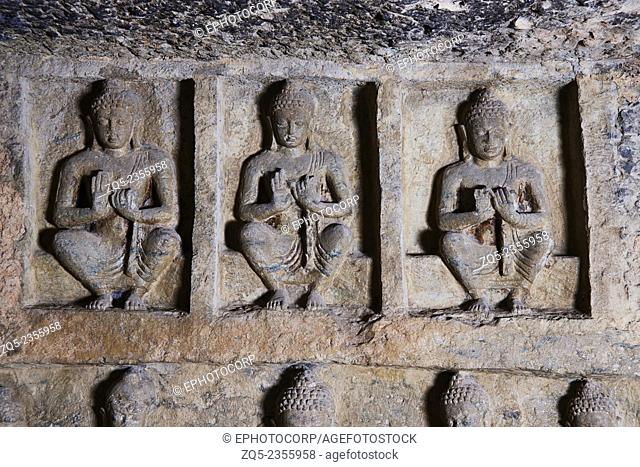 Cave 90 Buddhas in Dharmachakra pravartana mudra close to ceiling, on left wall of main hall. Kanheri Caves Borivali, India