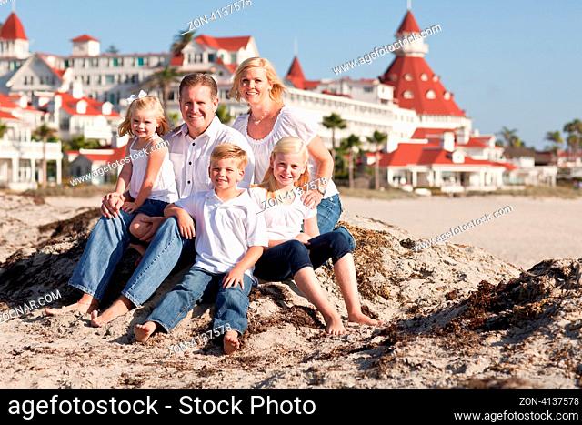 Happy Caucasian Family in Front of Hotel Del Coronado, U.S.A., on a Sunny Afternoon