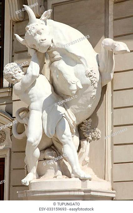 Vienna, Austria - Hofburg Palace sculpture of Hercules fighting the Cretan Bull. The Old Town is a UNESCO World Heritage Site