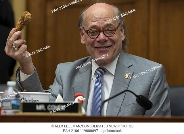 Representative Steve Cohen, Democrat of Tennessee, holds a piece of chicken from a bucket of Kentucky Fried Chicken he brought with him prior to a hearing...
