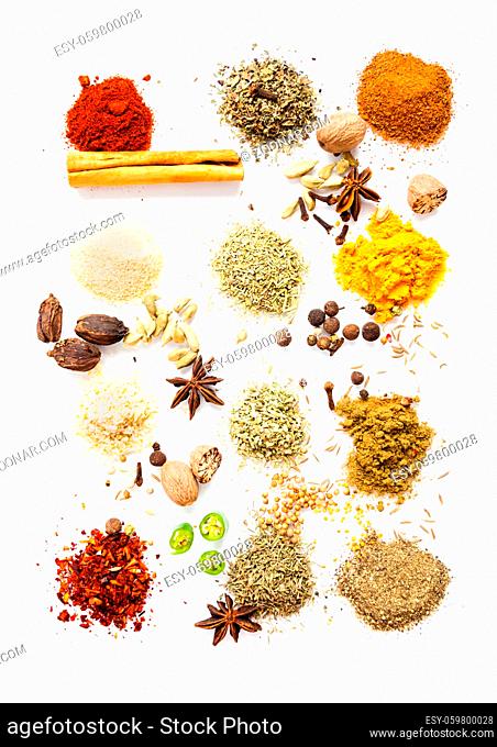Dry herbs and spices top view, beautiful food concept isolated on white