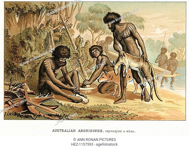 Australian natives preparing meal from an animal they have hunted, c1895. The man on the left makes a fire by the blister method