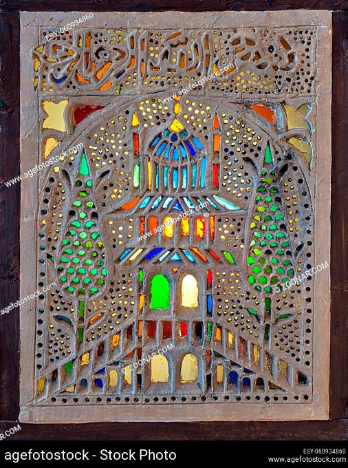 Perforated stucco window decorated with colorful stain glass with floral patterns, one of the traditions of the Ottoman era