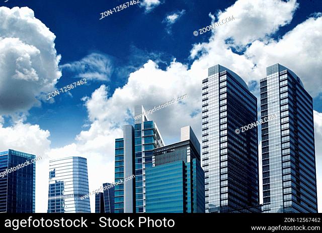 Modern and futuristic commercial business building with blue sky background from street point of view