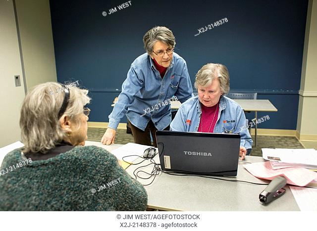 Harper Woods, Michigan - Volunteers from the AARP prepare income tax returns for low- and moderate-income senior citizens