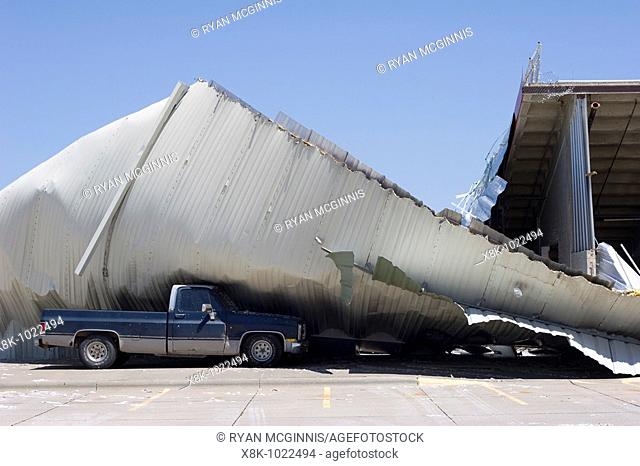 A pickup truck is pinned beneath the destroyed Buffalo County Exposition Building in Kearney, Nebraska, May 30, 2008  Kearney was struck by an EF-2 tornado on...