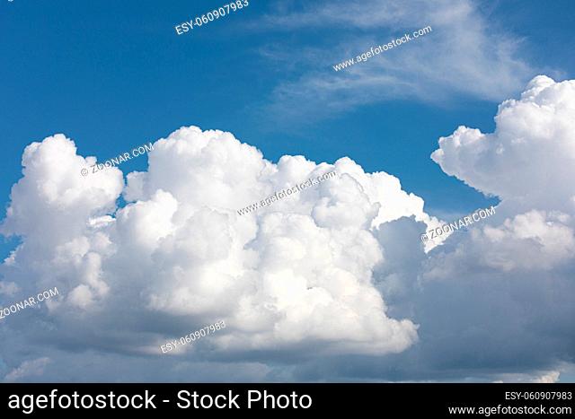 Fluffy cloud edge and blue sky cloudscape background