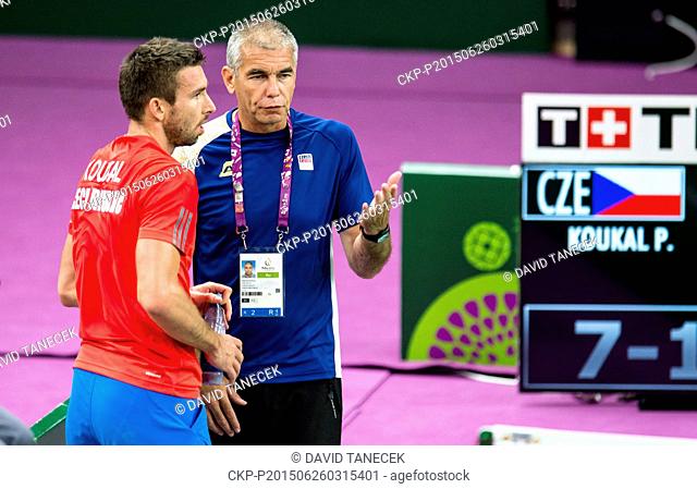 Czech player Petr Koukal, left, and his coach Petr Koukal Sr. pictured during the badminton men's singles quarterfinal match at the Baku 2015 1st European Games...