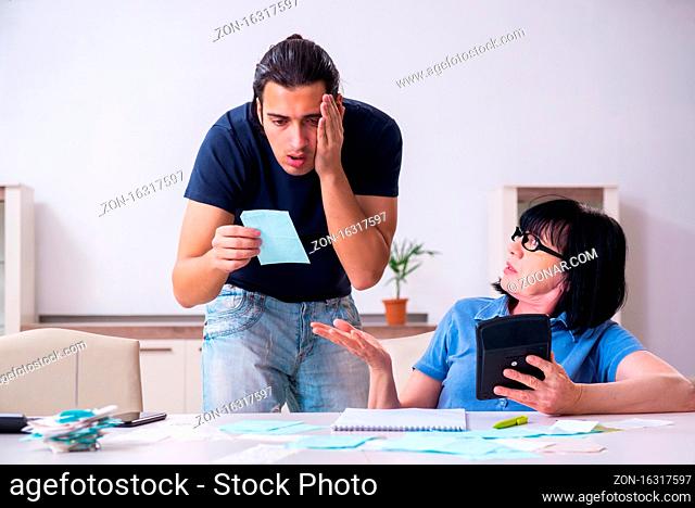 Female retiree and her young son in budget planning concept