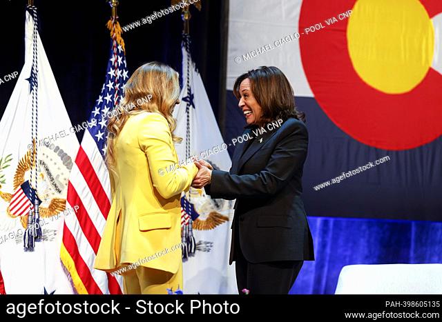Sasha DiGiulian, a professional rock climber, left, greets United States Vice President Kamala Harris before speaking with her at the Arvada Center for...