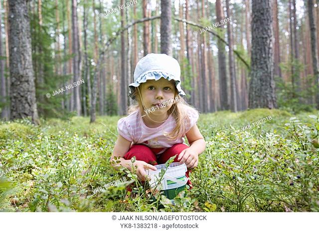 Three Year Old Berry-Picker Girl in Forest