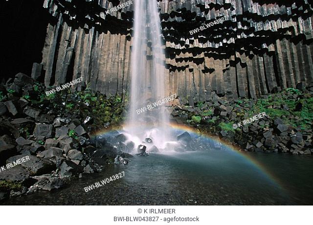 waterfall Svartifoss, basalt columns and rainbow, Iceland