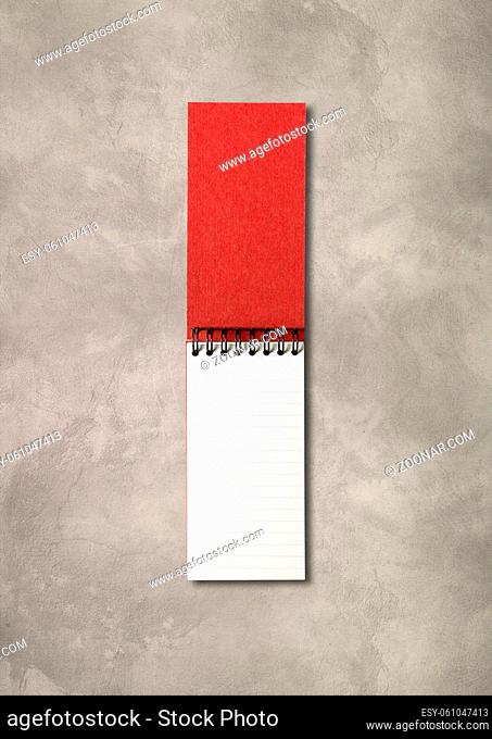 Blank open spiral notebook mockup isolated on concrete background
