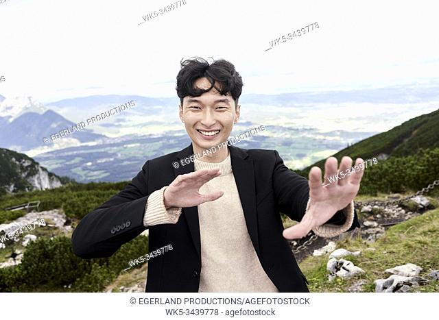 Korean man at mount Untersberg near Salzburg, Austria, Europe