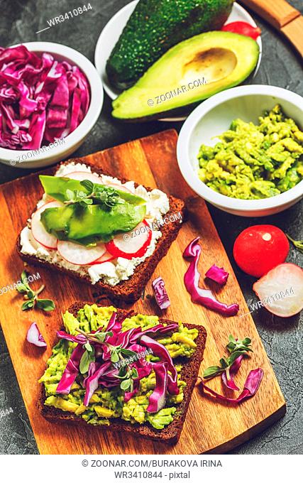Toasts with cream cheese, radish and avocado and with avocado and red cabbage