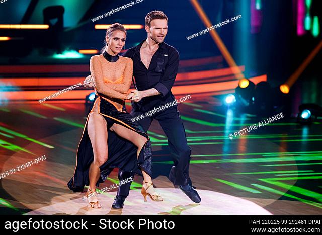25 February 2022, North Rhine-Westphalia, Cologne: Sarah Mangione, presenter, and Vadim Garbuzov, professional dancer, dance in the RTL dance show ""Let's...