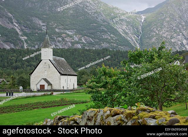 Eidfjord old church, an historic white Christian church, built in the 14th Century, on a beautiful sunny day, in a mountainous landscape in the Norwegian Fjords...