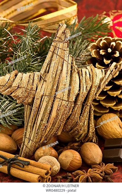 Christmas decoration with a star and pine cone as closeup