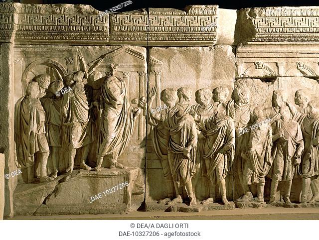 Roman civilization, 2nd century A.D. Model of Trajan's Column (Rome) Detail: Trajan, surrounded by lictors, announcing the inception of the Alimenta(a welfare...