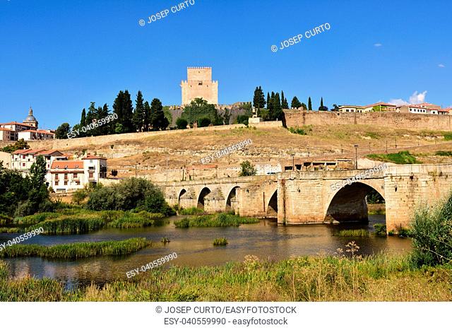 view of bridge and the Castle of Henry II of Castile (14th century) and River Agueda, Ciudad Rodrigo, Castile and Leon, Spain