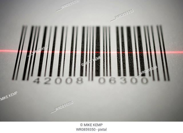 Close-up of a bar code being scanned with a laser light