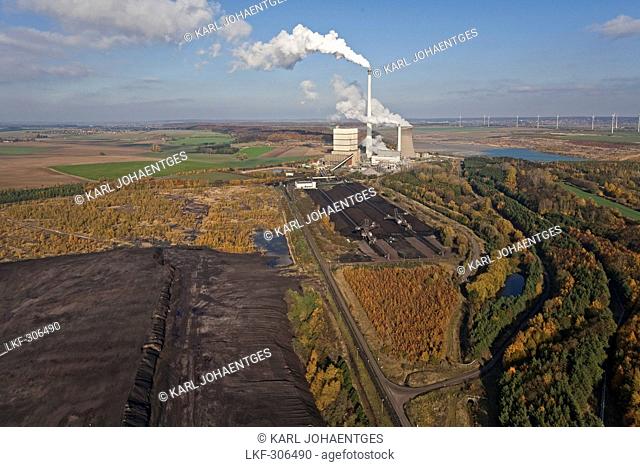 Aerial view of a lignite open-pit mine at fossil-fuel power station Buschhaus, cooling towers in the background, Helmstedt, Lower Saxony, northern Germany