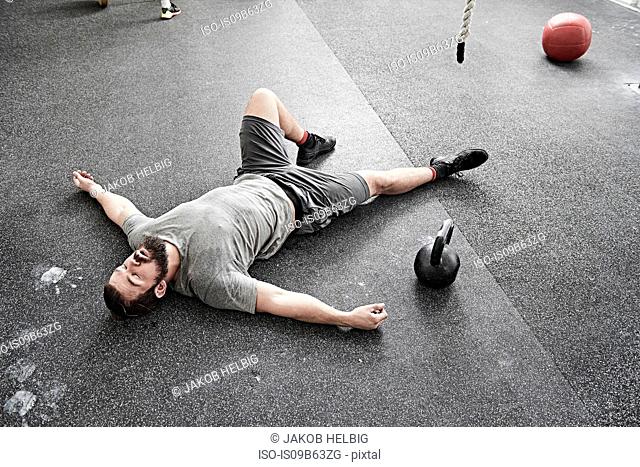 Man taking break in cross training gym