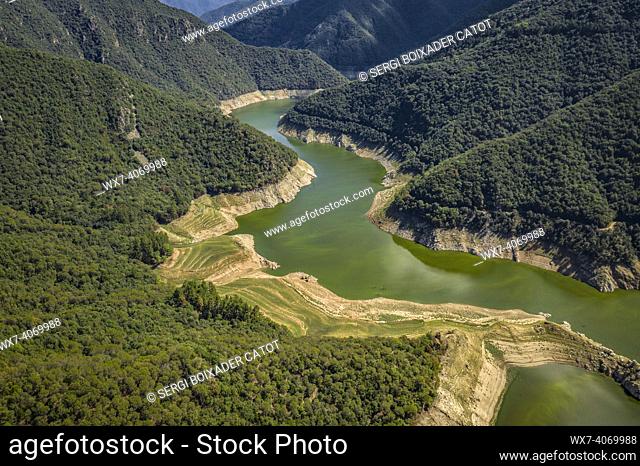 Aerial view of the Susqueda reservoir in the Sant Martí de Querós area during the summer drought of 2022 (Les Guilleries, Girona, Catalonia, Spain)