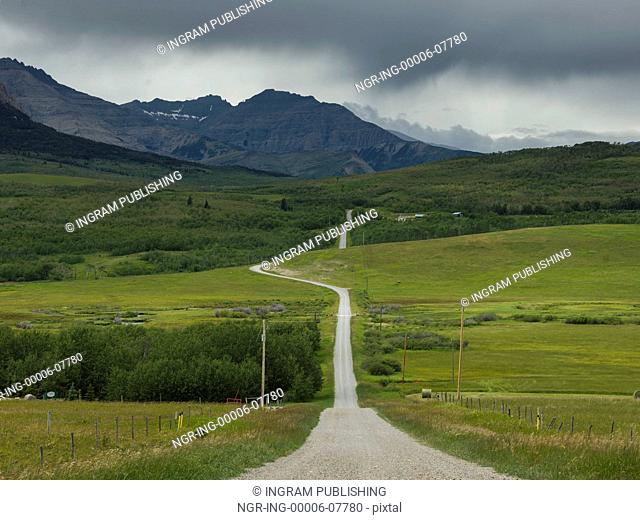 Country road passing through landscape, Pincher Creek No. 9, Southern Alberta, Alberta, Canada