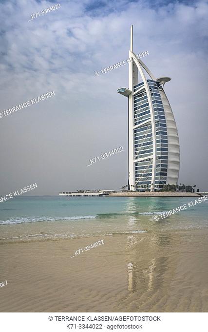 The Burj Al Arab Hotel and reflections in a sandy beach in Dubai, UAE, Middle East