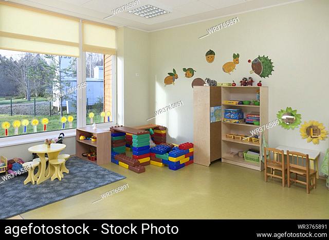 Modern children's day care or pre-school building, open indoors play area