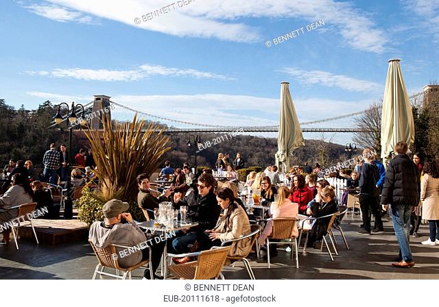 Drinkers on the terrace of the White Lion Bar with a view of the Clifton Suspension Bridge