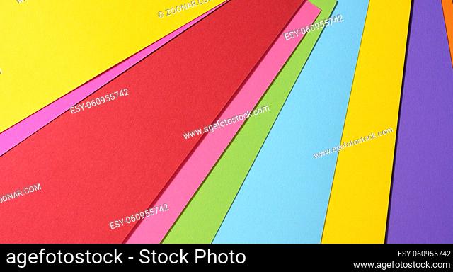 abstract bright background from multicolored paper, backdrop for designer, copy space
