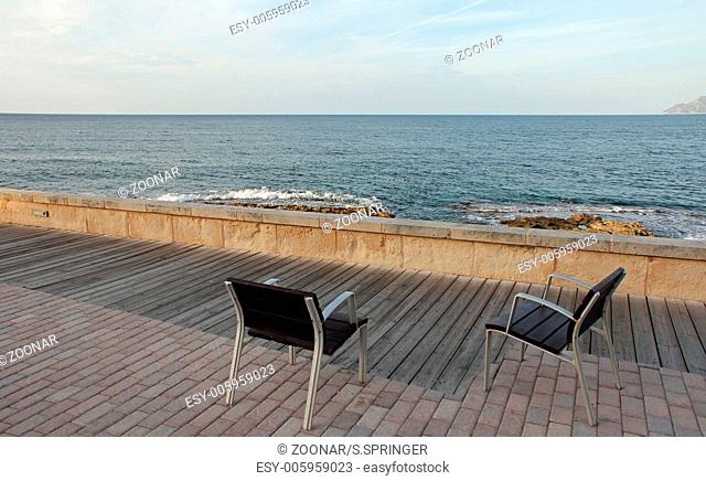 Two chairs and the sea