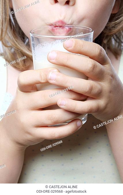 Little girl glass of milk