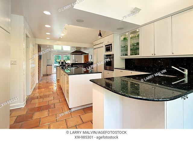 Kitchen in luxury home with spanish floor tile