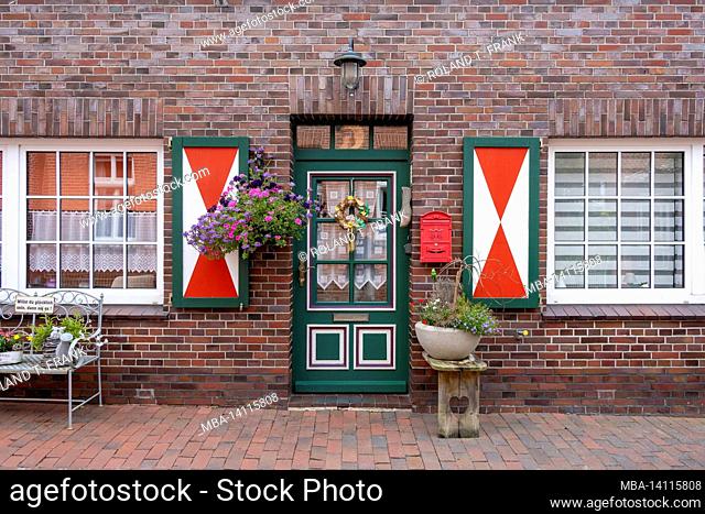 germany, lower saxony, east frisia, ditzum, typical facades with floral decorations